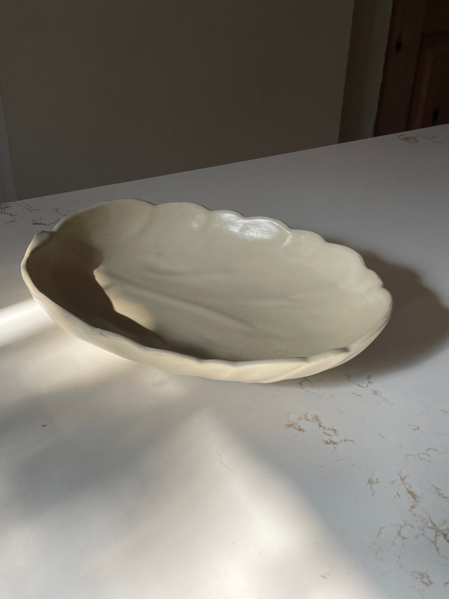 Tri-footed Cream Ceramic Leaf Bowl with Scalloped Edges