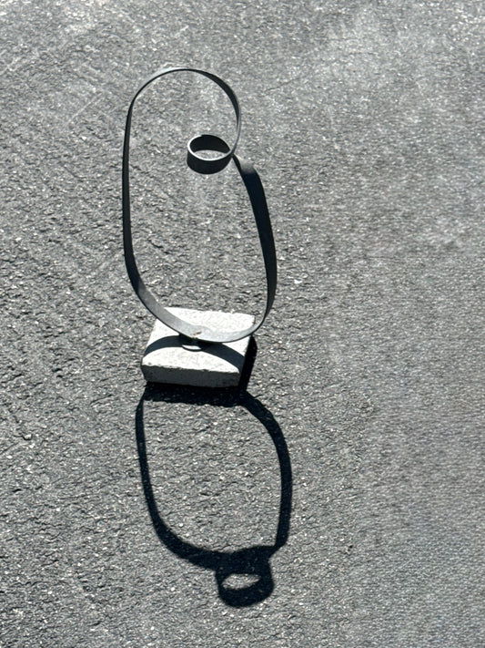 Minimalist Metal Loop Sculpture on Concrete Base