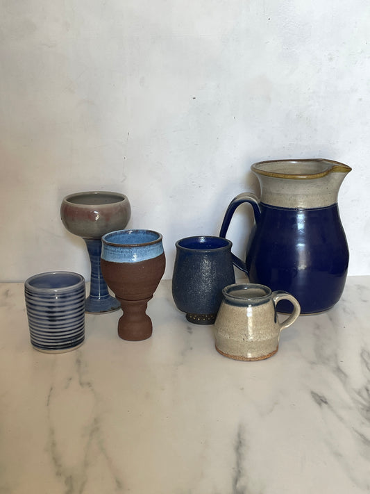 Item A. Far Left Blue Striped Mug